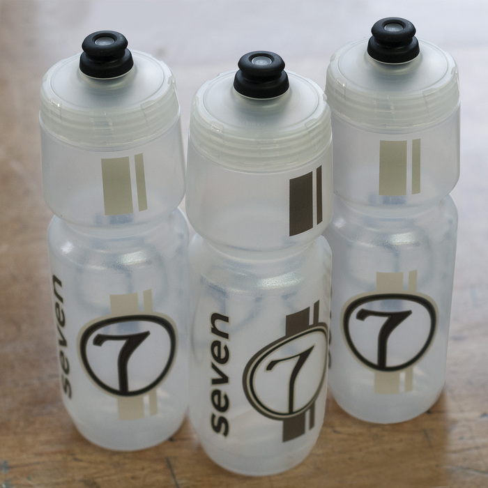 three waterbottles with seven graphics in gray colorways